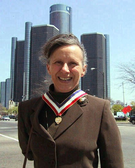 Wendy with award in front of GM Building (Renaissance Center) 
